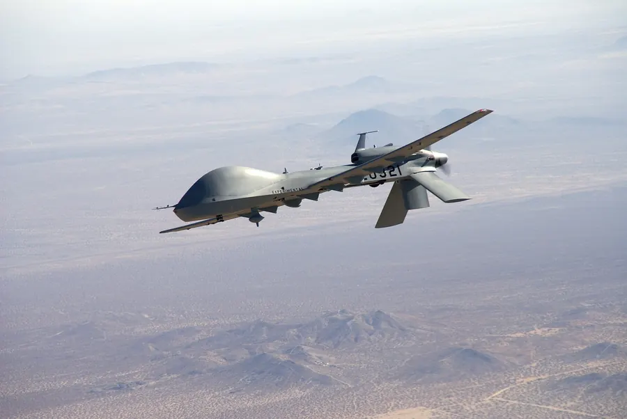 A tactical reconnaissance drone flying over mountains